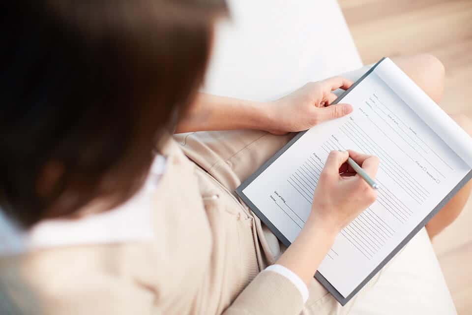 wife signing diy divorce forms